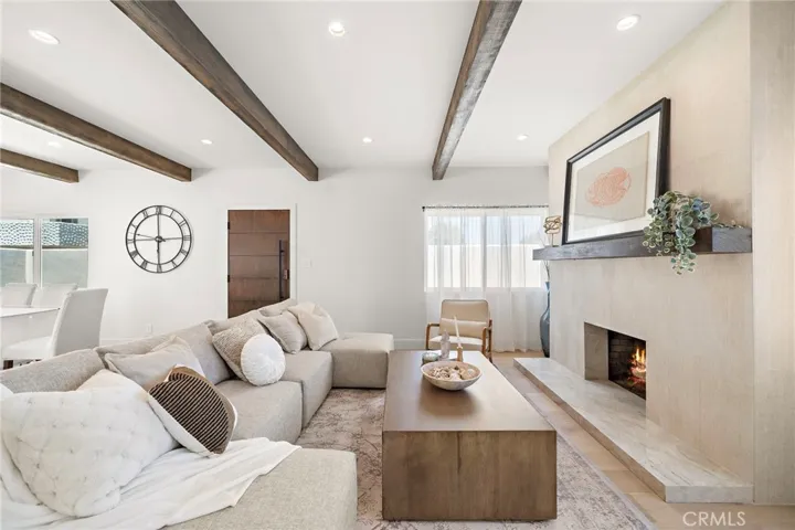 Front entry to living area with cozy fireplace
