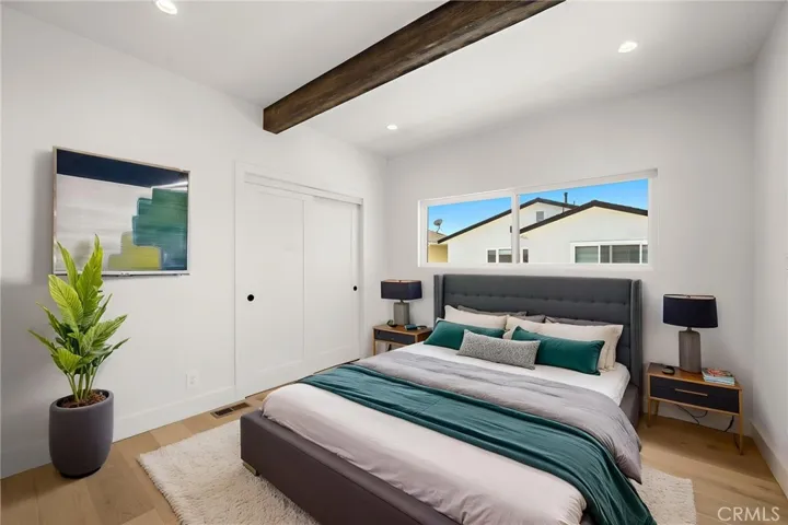 Secondary bedroom leads to the balcony/ Virtually staged