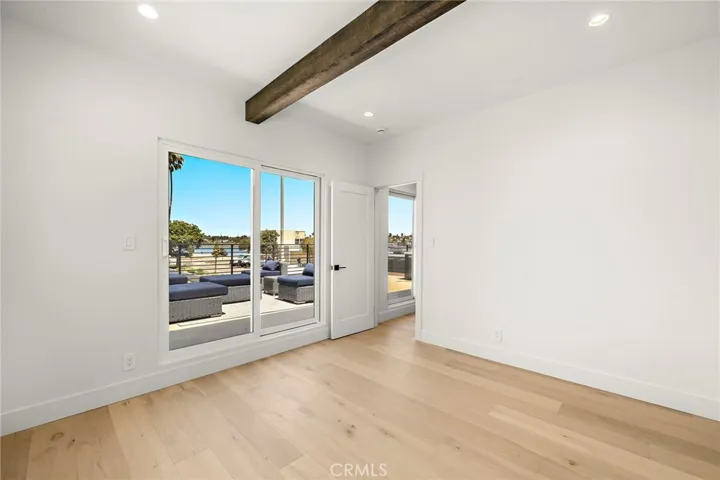 Secondary bedroom leads out to the balcony/ roof deck