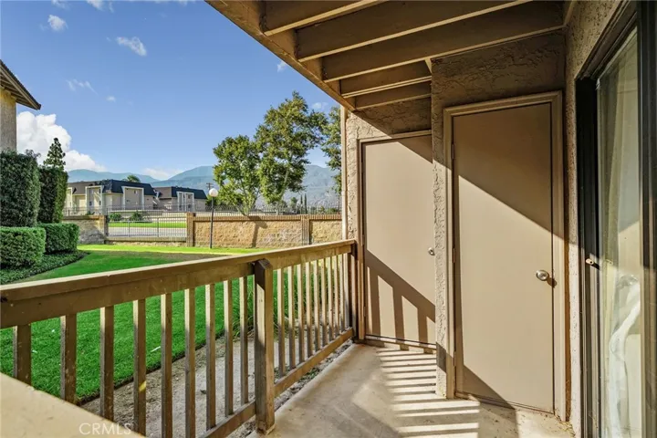 A peaceful outdoor retreat with mature landscaping and added storage closets for extra convenience.