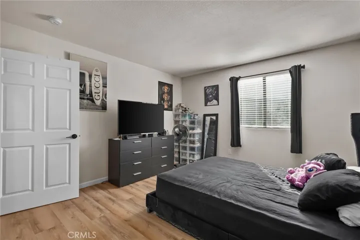 Spacious bedroom with ample closet storage and natural light.