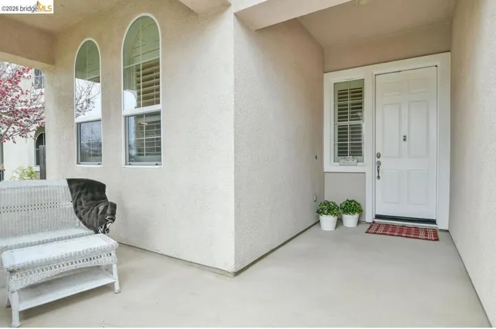 View of exterior entry featuring stucco siding