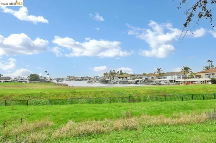 View of yard featuring a water view and a residential view