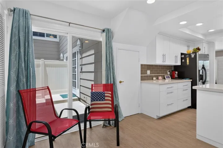 Dining area in kitchen and exit to front patio
