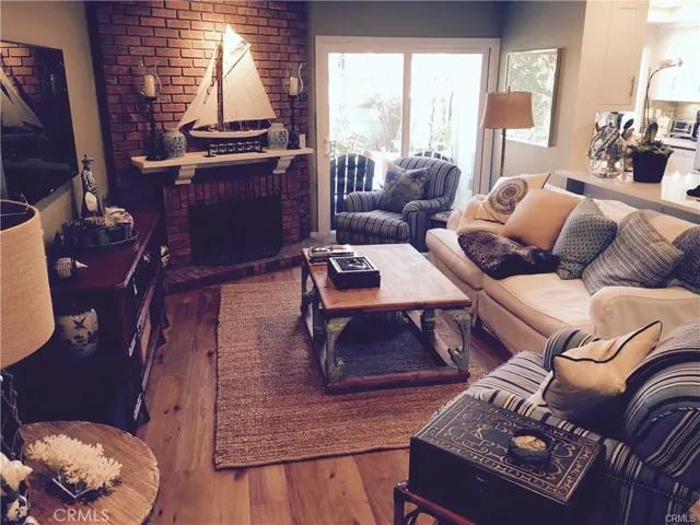 Family room w/fireplace and real wood floors
