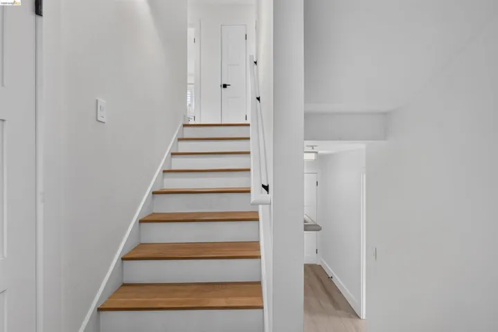 Staircase with wood-finish treads and white risers