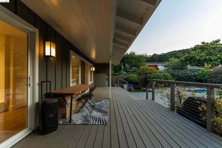 Spacious outdoor decking with a wood-finish surface, offering an expansive area for entertaining