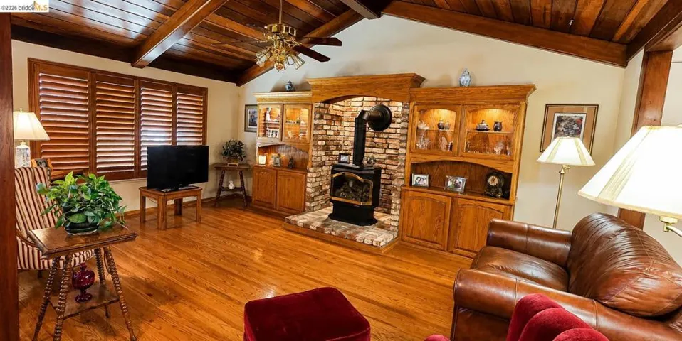 Vaulted wood-paneled ceiling with exposed beams