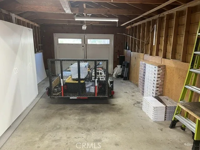 ROOMY GARAGE W/ ADDITL CABINETS