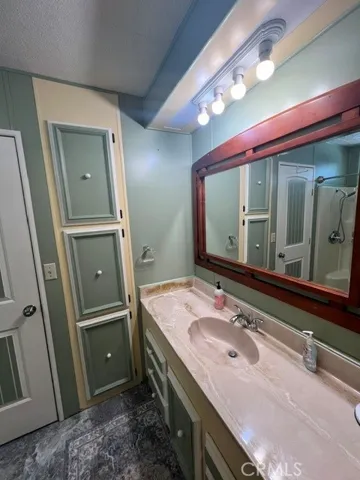 VIEW OFF LAUNDRY RM IN GUEST BATHROOM