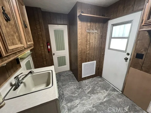 LAUNDRY ROOM OFF WEST SIDE ENTRANCE