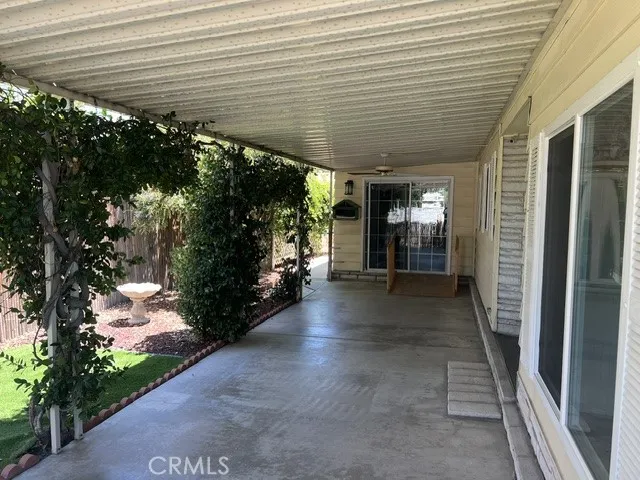 A PATIO OFF THE EAST SIDE ENTRANCE