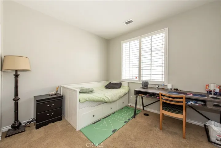Secondary bedroom with balcony access