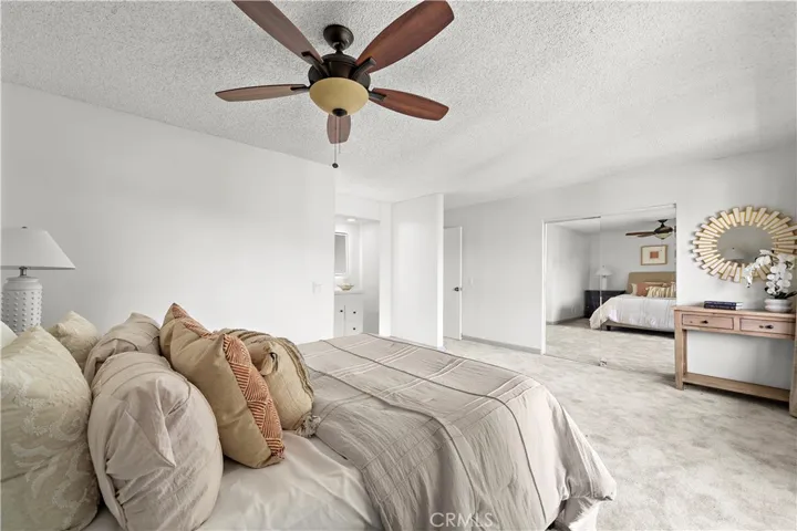 Primary Suite has Mirrored Walk-In Closet