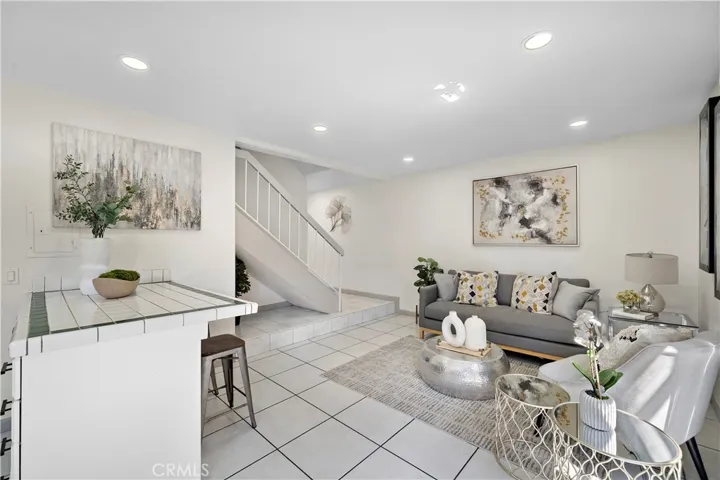 Kitchen with Tile Flooring is Open to a Cozy Family Room