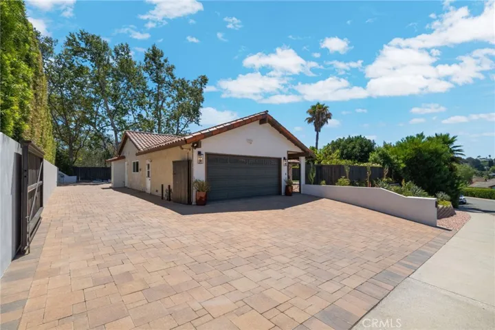 From the other end of the yard, with the side gate open shows how much space there is for storage!