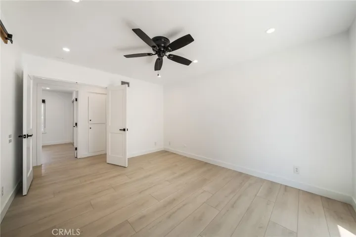 Primary bedroom has Double door entry and ceiling fan.