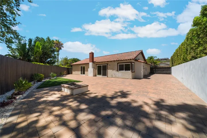 From the back corner of yard you get a feel for the depth of the of the lot. On the right is the are that can be used as RV or recreational toys storage. In addition the back yard is large enough for family BBQ's and seating by gas Fire Pit.