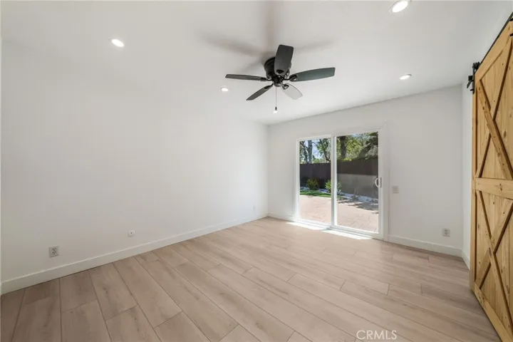 Primary bedroom has a slider to back patio area.
