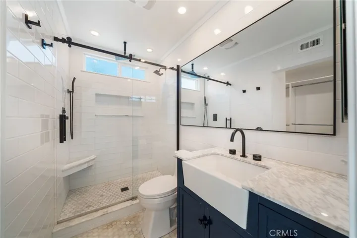 Beautiful remodeled Walk-in shower includes window for steam release.