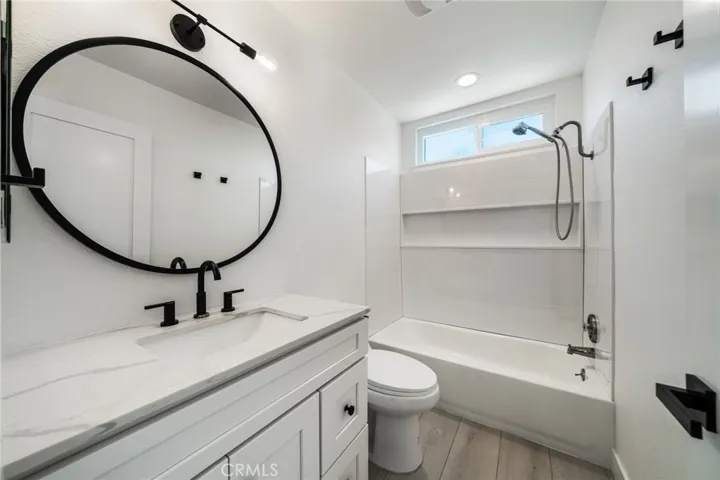 Secondary bath has shower in tub.