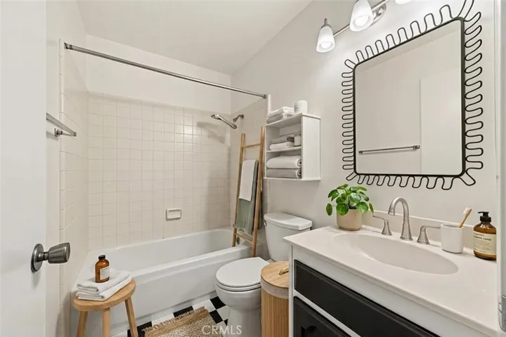 Guest full bathroom,  virtually staged and photo enhanced.