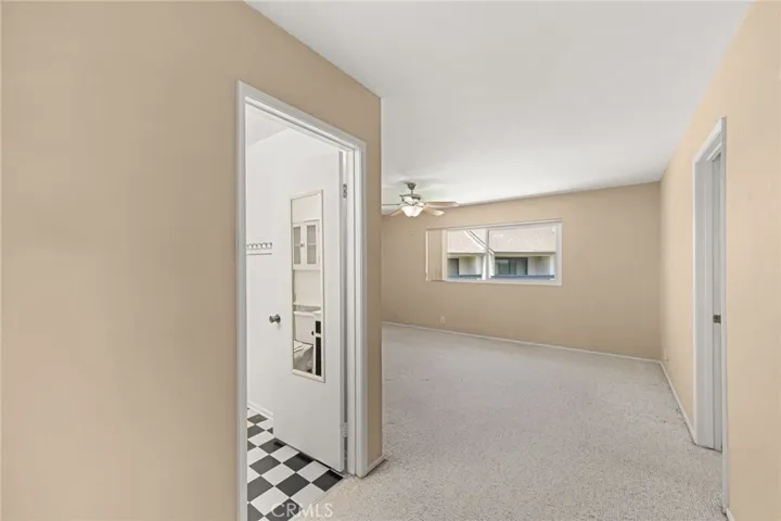 Primary bedroom with bathroom to the left and closet to the right.