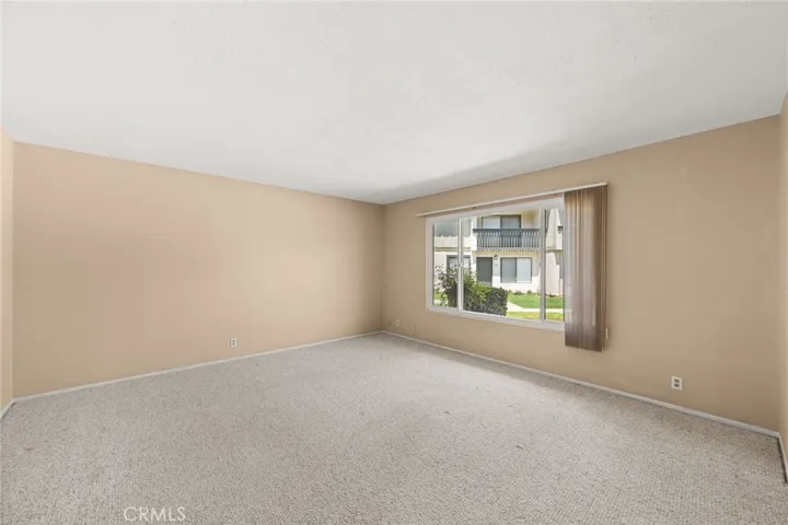 Living room with large window for natural light.