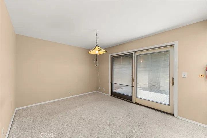 Dining room and sliding glass door leading to patio/garage.