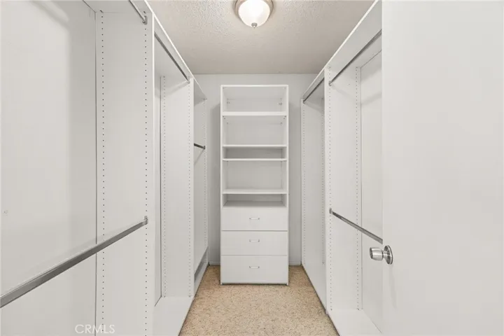 Primary bedroom walk-in closet.