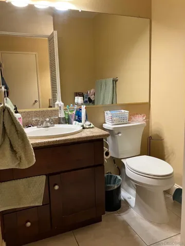 Guest bath - This partial bath has a bathroom cabinet and a toilet.