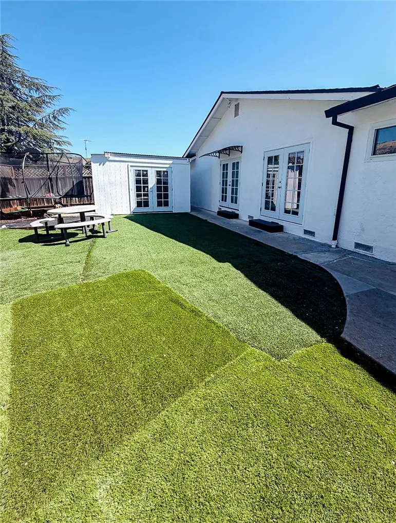 Side Backyard with Entertainment Room