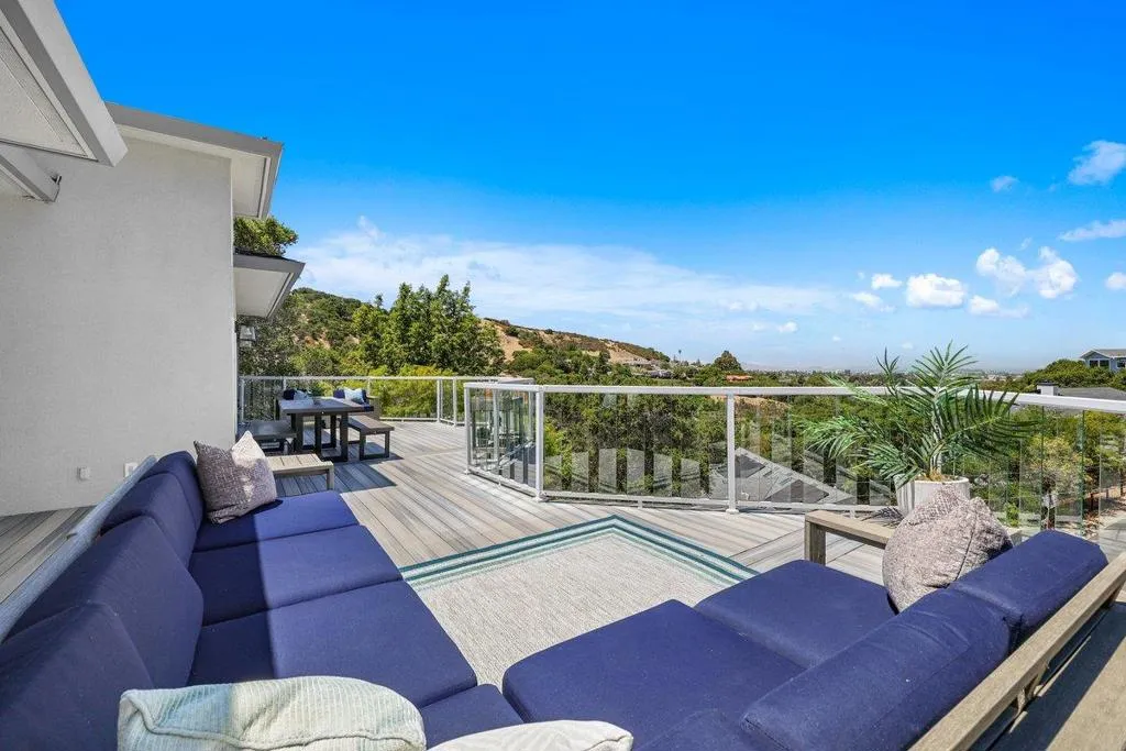 Viewing Wrap Around Deck (attached to kitchen, dining, and living rooms for easy entertaining).