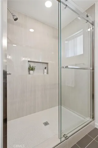 Primary bathroom with a step in full sized shower.