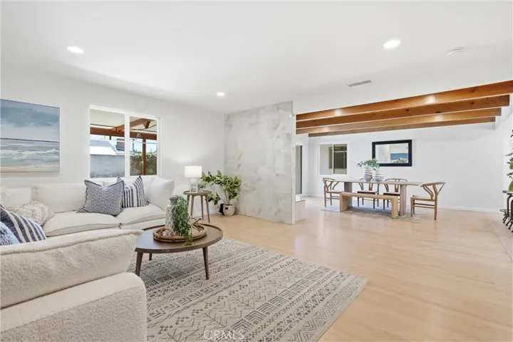 The redesigned home presents an open floor plan.