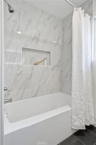 Shower over tub in the hall bathroom #2 on the north side of the home.