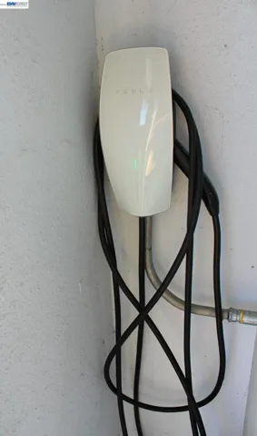 EV-ready with a Tesla Wall Connector already installed, making home charging convenient and adding modern functionality for electric vehicle owners.