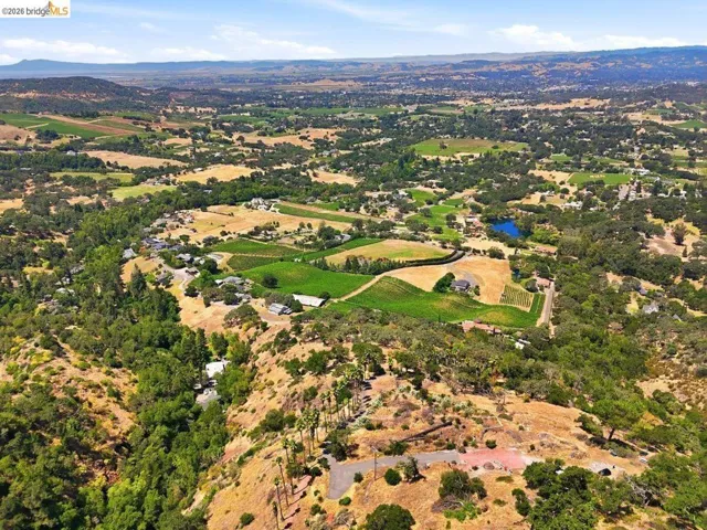 Expansive aerial showcasing a landscape of rolling hills and views of the Napa Valley