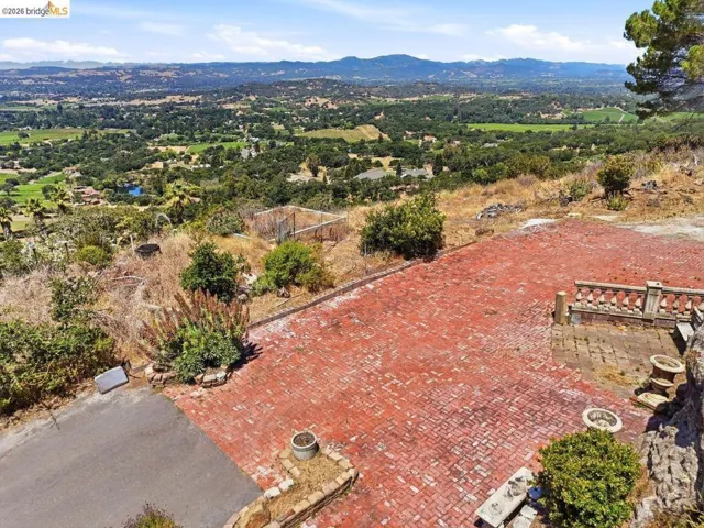 Aerial view of the expansive paved are with Napa Valley view beyond