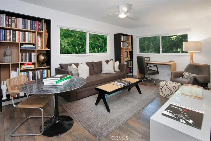 Two additional bedrooms enjoy treetop and hillside views, modern ceiling fans, and generous closet space.