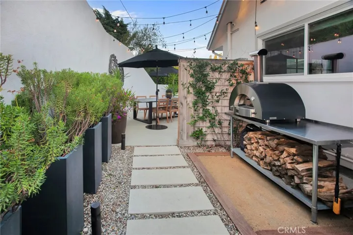 Multiple outdoor spaces, and the sparkling heated saltwater pool invite everything from lively weekend gatherings to quiet mornings with a cup of coffee. A gas fireplace, mature landscaping, newer smart-controlled pool equipment, and peaceful hillside surroundings provide inviting spaces to enjoy throughout the year.