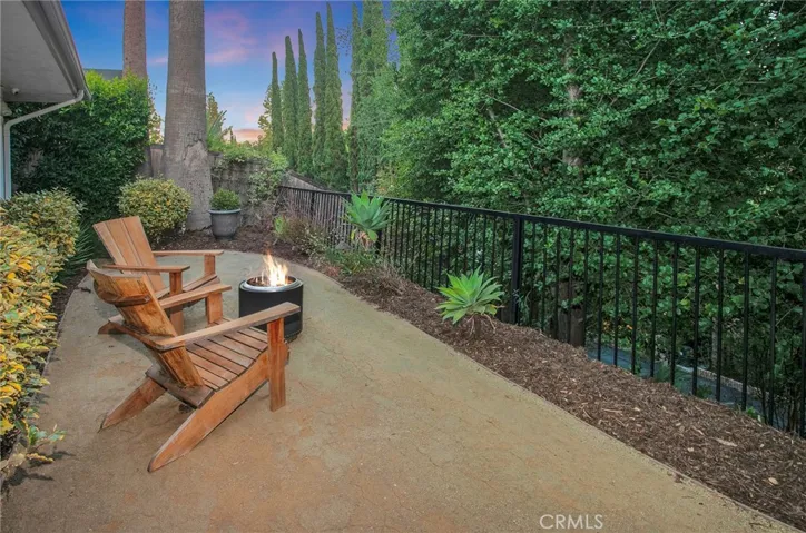 Multiple outdoor spaces, and the sparkling heated saltwater pool invite everything from lively weekend gatherings to quiet mornings with a cup of coffee. A gas fireplace, mature landscaping, newer smart-controlled pool equipment, and peaceful hillside surroundings provide inviting spaces to enjoy throughout the year.