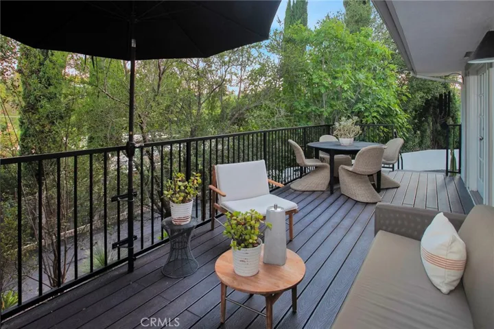 Beautiful deck adjacent to the living room. Perfect for quiet relaxation, entertaining, or al fresco dining.