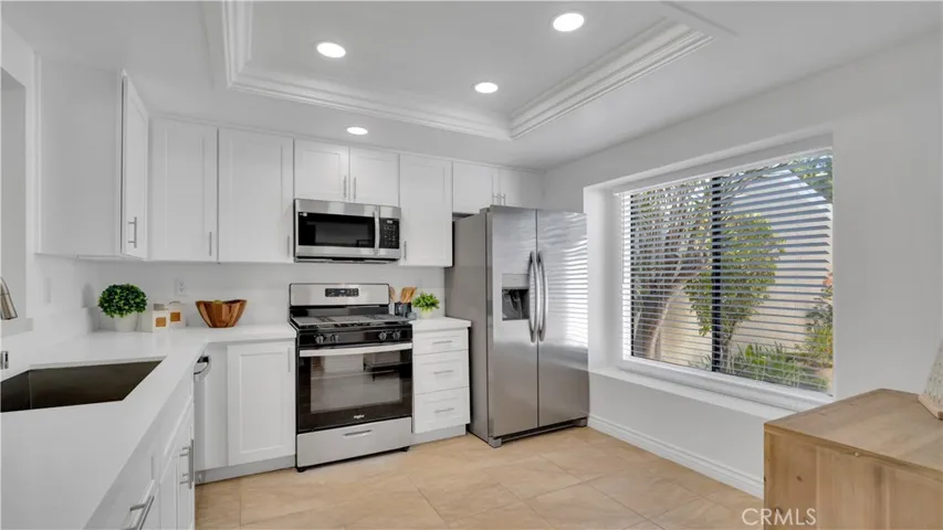 The refrigerator is included and there is plenty of room for a bistro table and chairs so you can enjoy your morning coffee. Notice the lighting has been upgraded here too.