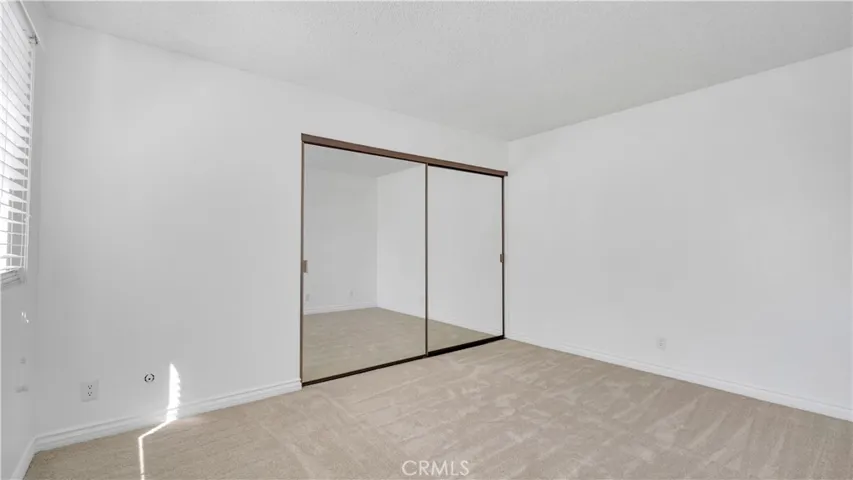 The secondary bedroom--fresh paint and new carpet.