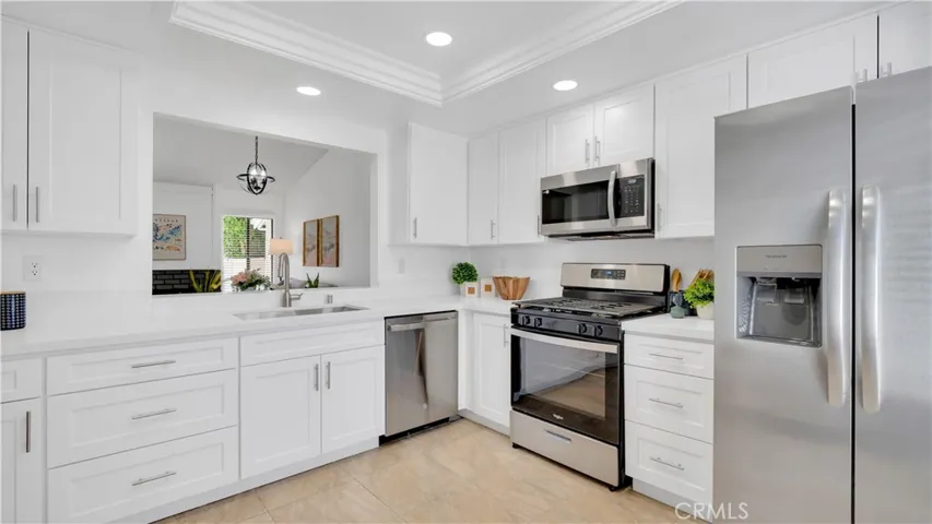 Brand new cabinets, quartz countertops and stainless appliances add to the charm of this kitchen.