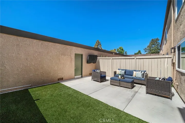 Newly remodeled back patio with artificial lawn, and TV cable hookups