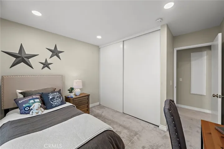 Large floor to ceiling closet with new recessed lighting