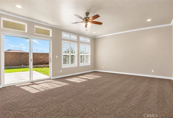 Virtually enhanced living room to reflect new carpet and removal of furnishings.