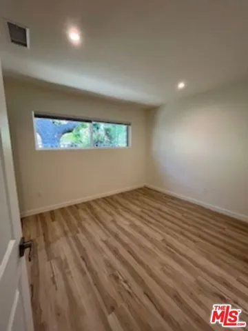 Bedroom1 with wood floors